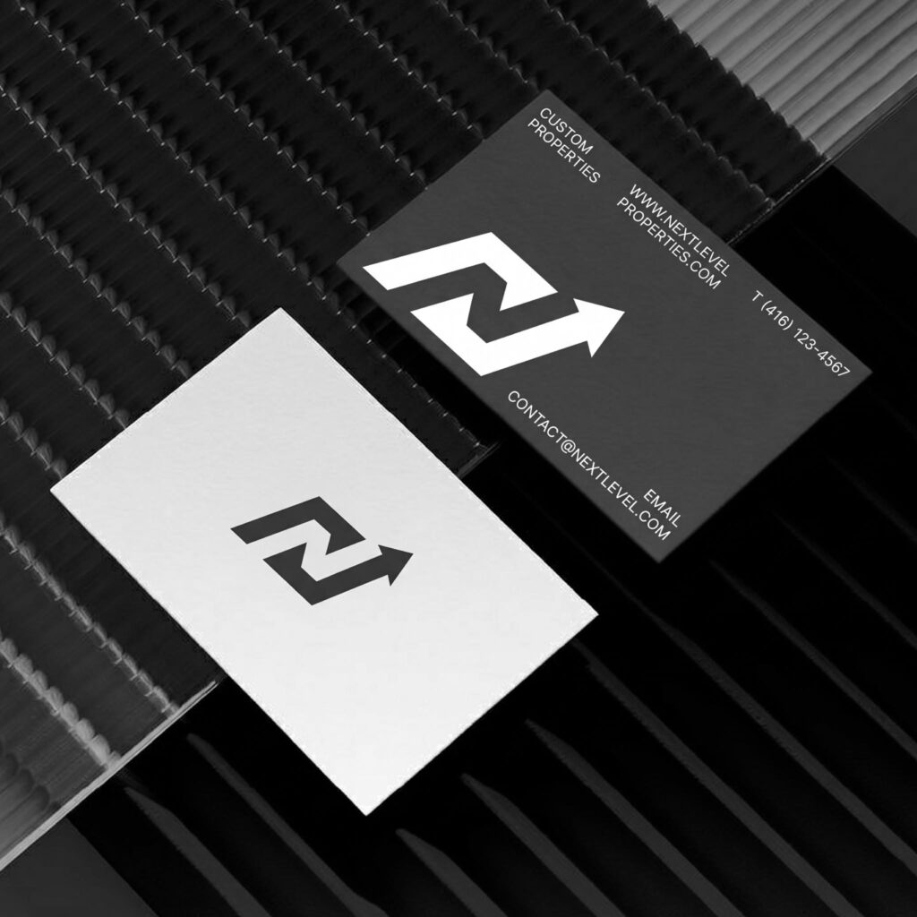 Professional business card branding design for a real estate company.